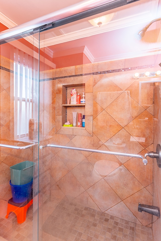 bathroom featuring ornamental molding and a shower stall