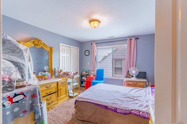 bedroom with carpet, a closet, and visible vents