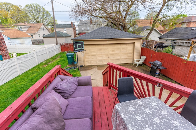 deck featuring a lawn, a detached garage, an outdoor structure, a fenced backyard, and outdoor lounge area