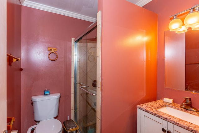 bathroom featuring crown molding, toilet, a shower stall, and vanity