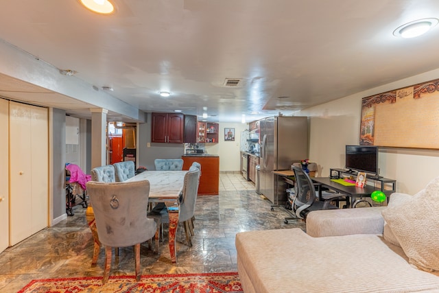 dining room with stone finish floor and visible vents
