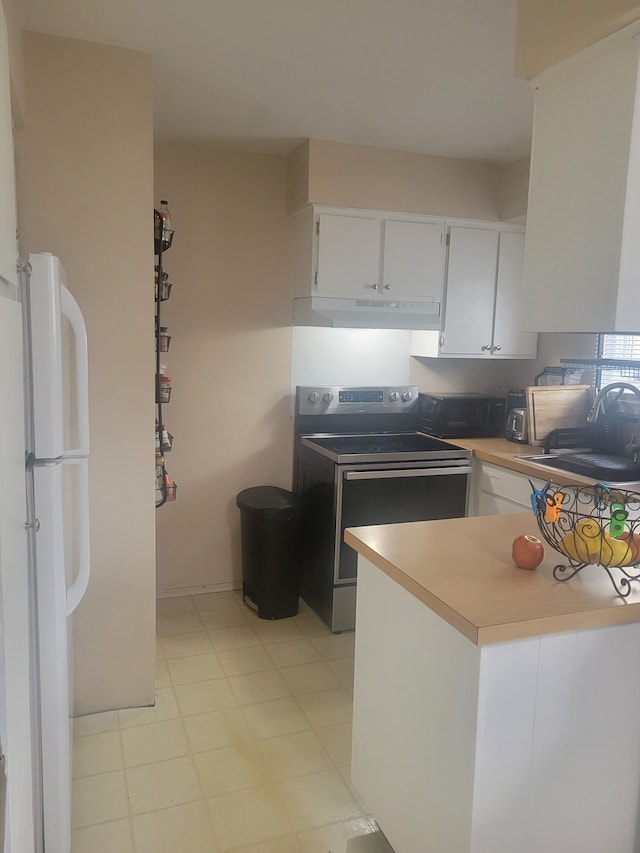 3022 Wolverine Dr, Ann Arbor, MI 48108 - kitchen featuring freestanding refrigerator, white cabinetry, range with electric stovetop, and a sink