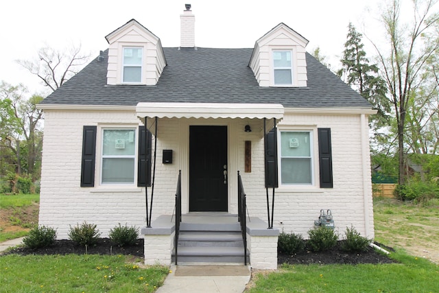 16221 Santa Rosa Dr, Detroit, MI 48221 - cape cod-style house featuring brick siding, a shingled roof, and a chimney