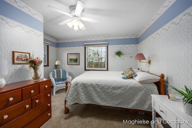 bedroom featuring wallpapered walls, carpet, and a ceiling fan