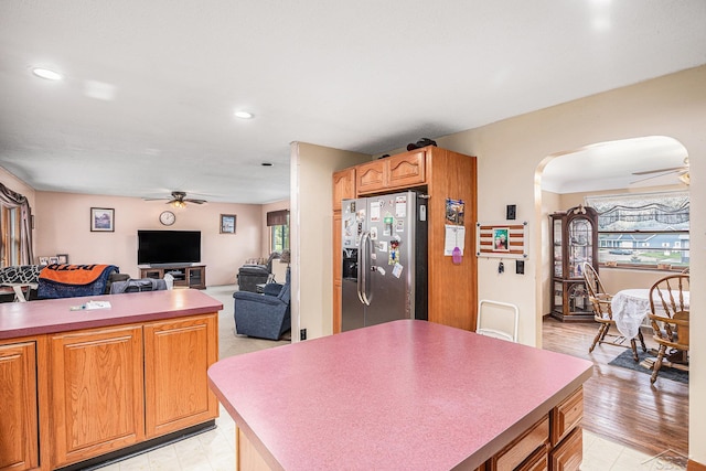 11965 Speaker Rd, Yale, MI 48097 - kitchen featuring stainless steel refrigerator with ice dispenser, a ceiling fan, recessed lighting, and arched walkways