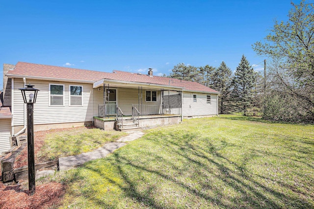 11965 Speaker Rd, Yale, MI 48097 - rear view of property with a lawn and covered porch