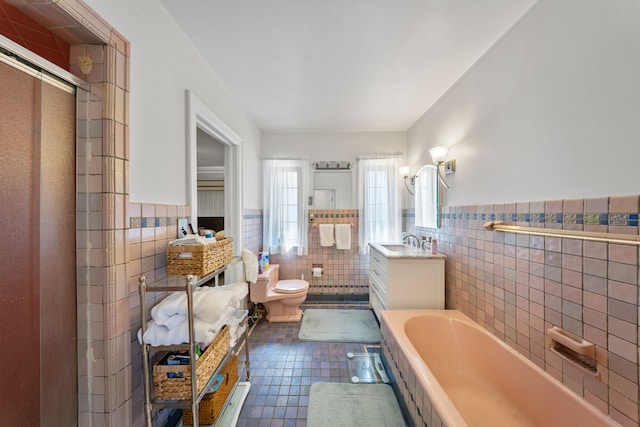 725 W Boston Blvd, Detroit, MI 48202 - bathroom featuring toilet, tile walls, an enclosed shower, a wainscoted wall, and tile patterned floors