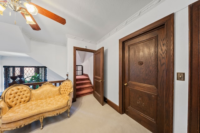 725 W Boston Blvd, Detroit, MI 48202 - living area featuring light colored carpet, a ceiling fan, baseboards, and crown molding