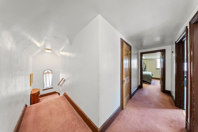 725 W Boston Blvd, Detroit, MI 48202 - corridor with light colored carpet, baseboards, and an upstairs landing