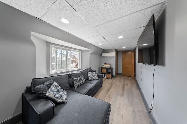 725 W Boston Blvd, Detroit, MI 48202 - living area with recessed lighting, a drop ceiling, a wall unit AC, and light wood-style flooring