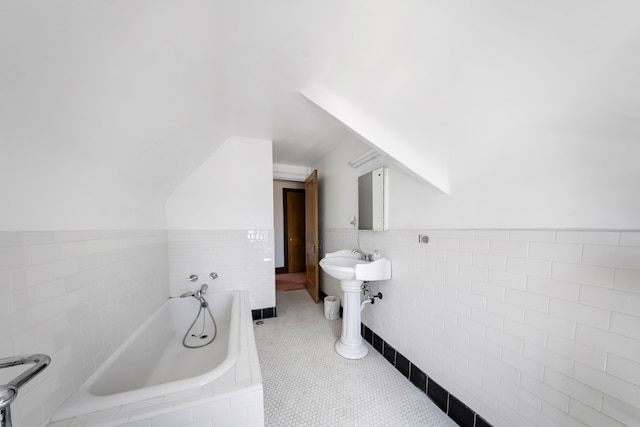 725 W Boston Blvd, Detroit, MI 48202 - full bathroom with tile walls, a wainscoted wall, and a bath