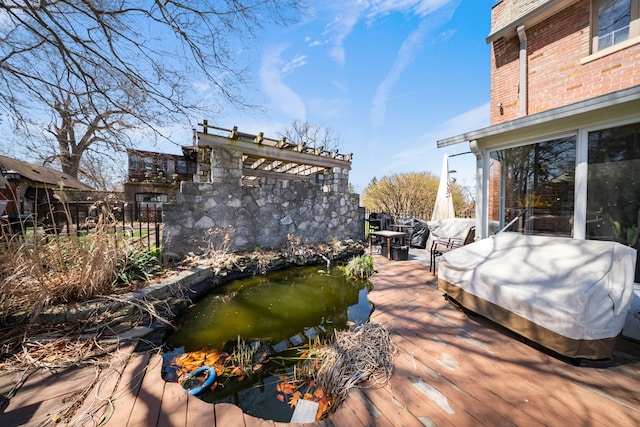 725 W Boston Blvd, Detroit, MI 48202 - wooden terrace with a garden pond