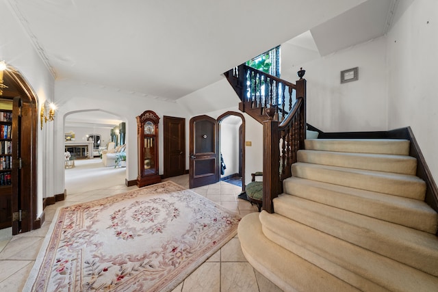 725 W Boston Blvd, Detroit, MI 48202 - entrance foyer featuring baseboards, arched walkways, and stairway