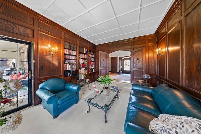 725 W Boston Blvd, Detroit, MI 48202 - living area with wooden walls, arched walkways, built in features, and carpet flooring