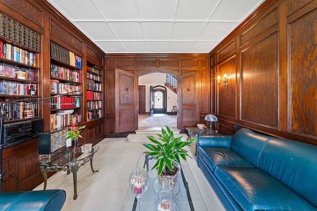 725 W Boston Blvd, Detroit, MI 48202 - sitting room featuring carpet floors, arched walkways, built in features, and wooden walls