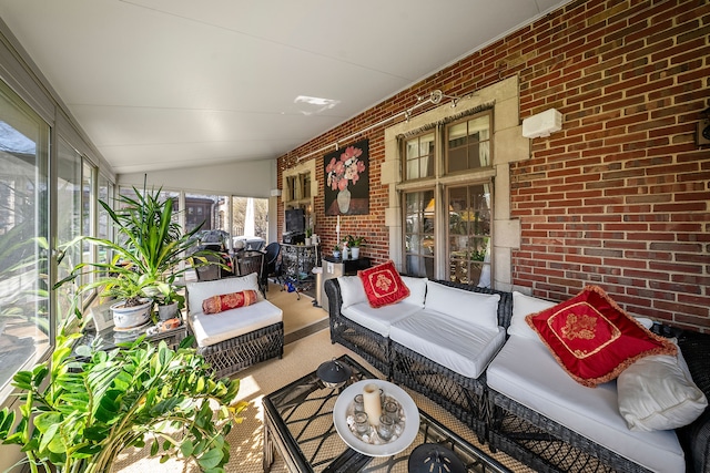 725 W Boston Blvd, Detroit, MI 48202 - sunroom with an outdoor hangout area, carpet flooring, brick wall, and vaulted ceiling