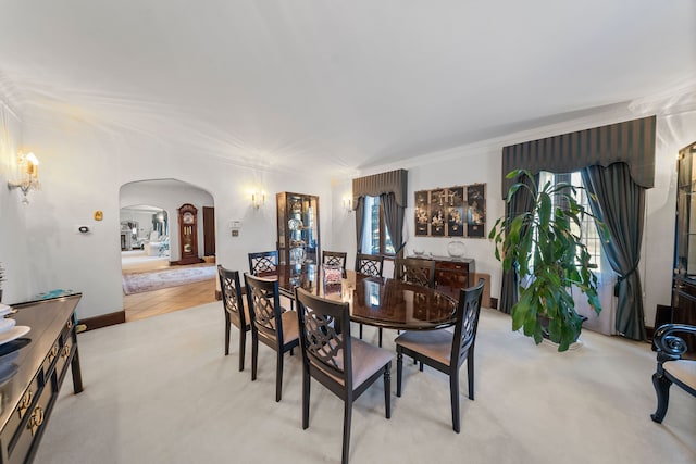 725 W Boston Blvd, Detroit, MI 48202 - dining room featuring arched walkways and light colored carpet