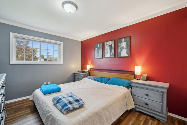 bedroom with baseboards, ornamental molding, and dark wood-style floors