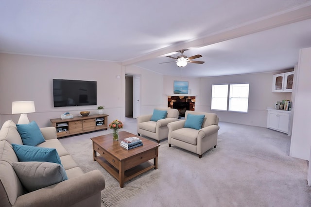living room featuring a ceiling fan, light carpet, crown molding, and beamed ceiling
