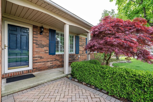 6228 Atkins Dr, Troy, MI 48085 - doorway to property with brick siding