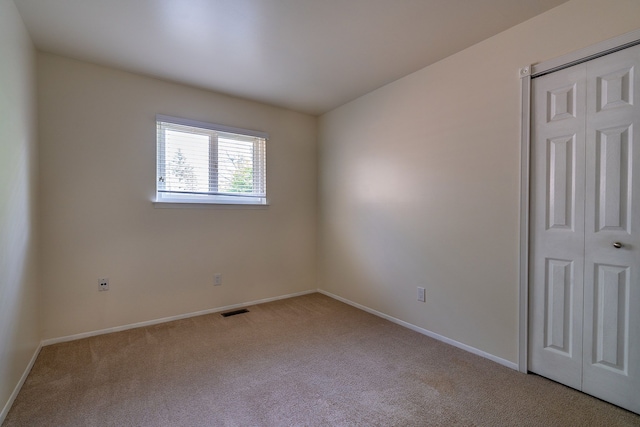 6228 Atkins Dr, Troy, MI 48085 - spare room featuring carpet flooring and baseboards