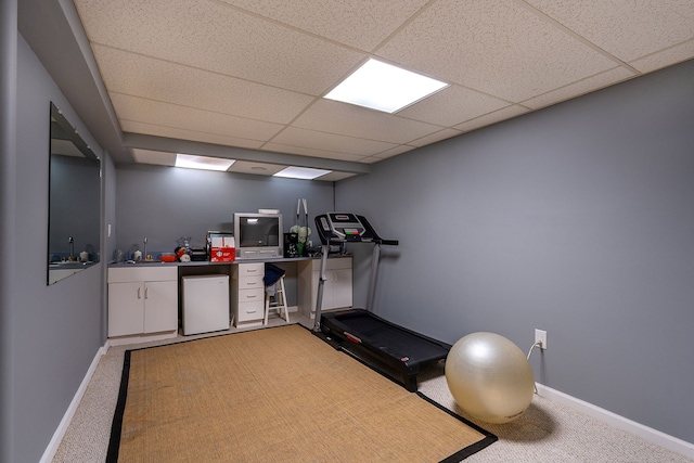 6228 Atkins Dr, Troy, MI 48085 - exercise area with light carpet, a paneled ceiling, a sink, and baseboards
