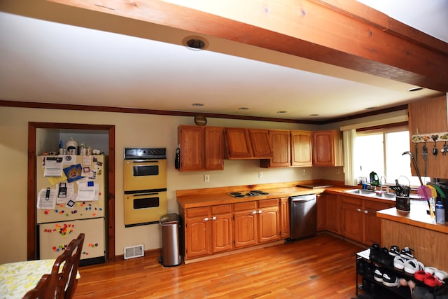 13799 31 Mile Rd, Washington, MI 48095 - kitchen featuring freestanding refrigerator, dishwasher, double oven, light wood finished floors, and cooktop