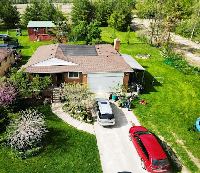13799 31 Mile Rd, Washington, MI 48095 - single story home with driveway, a front lawn, an attached garage, a porch, and brick siding