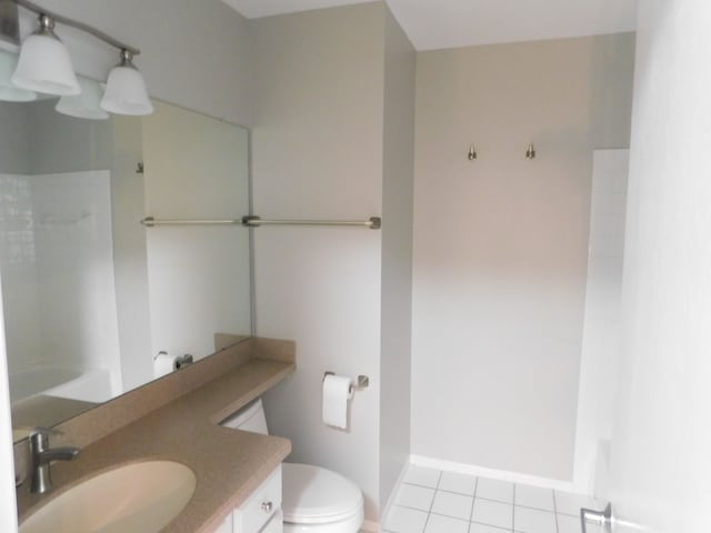 full bath featuring toilet, walk in shower, tile patterned flooring, and vanity