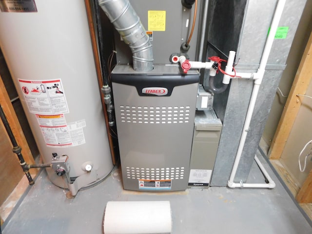 utility room featuring gas water heater