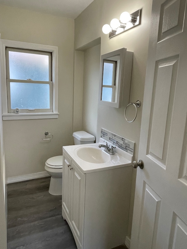 97 N Roselawn St, Pontiac, MI 48342 - bathroom featuring toilet, plenty of natural light, wood finished floors, and vanity