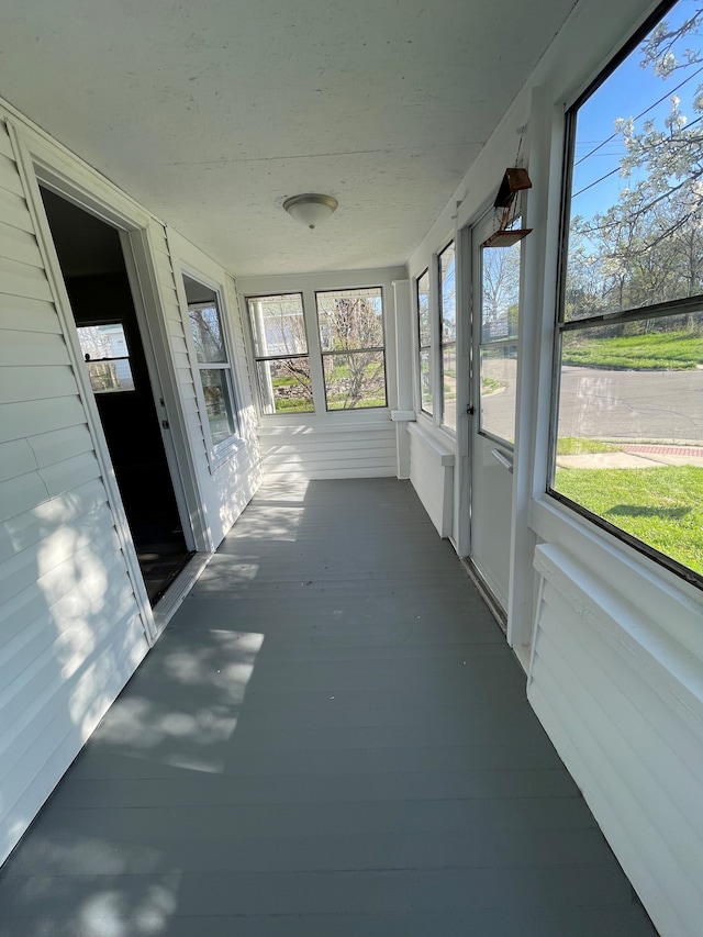 97 N Roselawn St, Pontiac, MI 48342 - unfurnished sunroom with a healthy amount of sunlight and wood finished floors