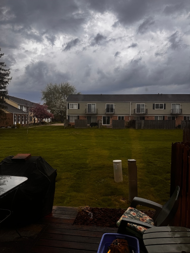 back of property featuring a lawn