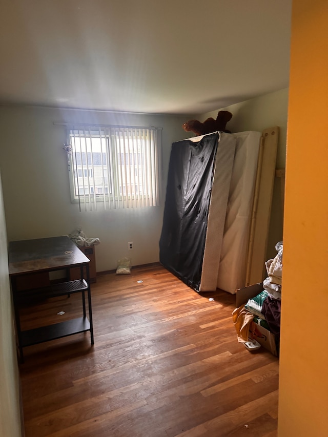 bedroom featuring wood finished floors