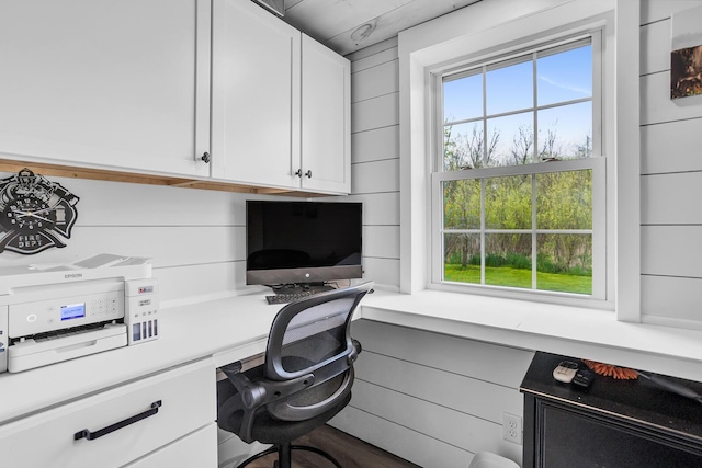 home office with built in study area and a healthy amount of sunlight