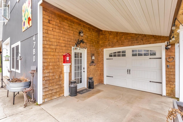 view of exterior entry with concrete driveway
