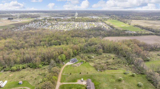 drone / aerial view with a view of trees