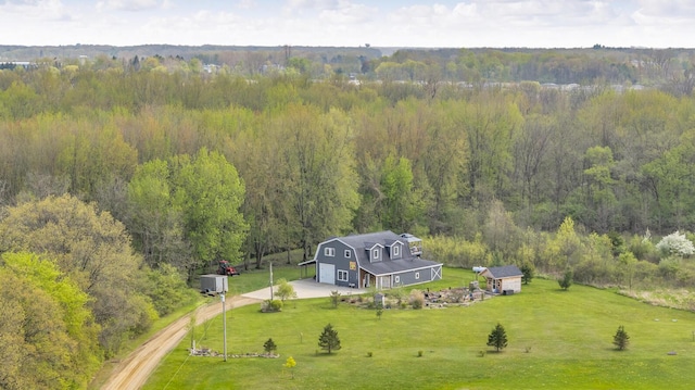 bird's eye view featuring a wooded view