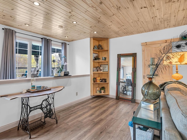 interior space featuring recessed lighting, baseboards, wood finished floors, and wooden ceiling