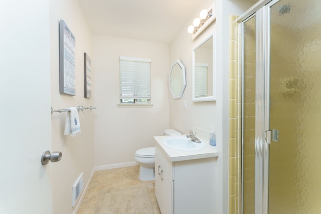 full bathroom with a shower stall, toilet, vanity, baseboards, and tile patterned flooring