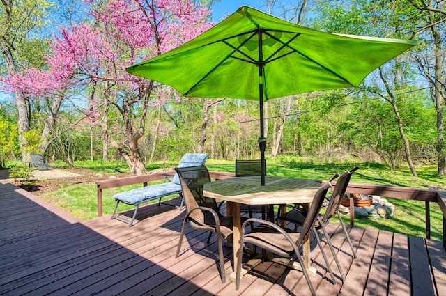 wooden terrace featuring outdoor dining space
