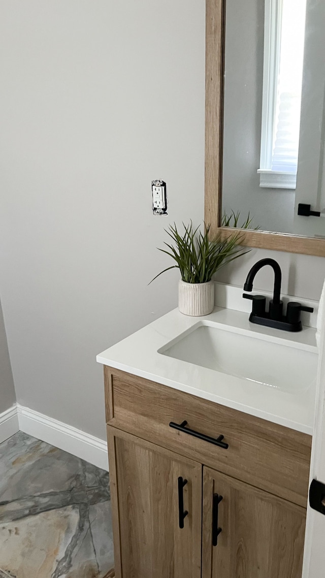 2439 Sheridan St, Detroit, MI 48214 - bathroom featuring vanity and baseboards