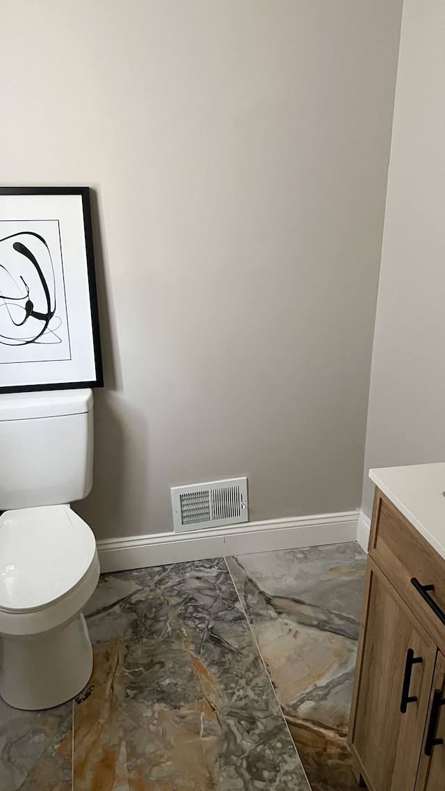 2439 Sheridan St, Detroit, MI 48214 - half bathroom with baseboards, marble finish floor, visible vents, and toilet