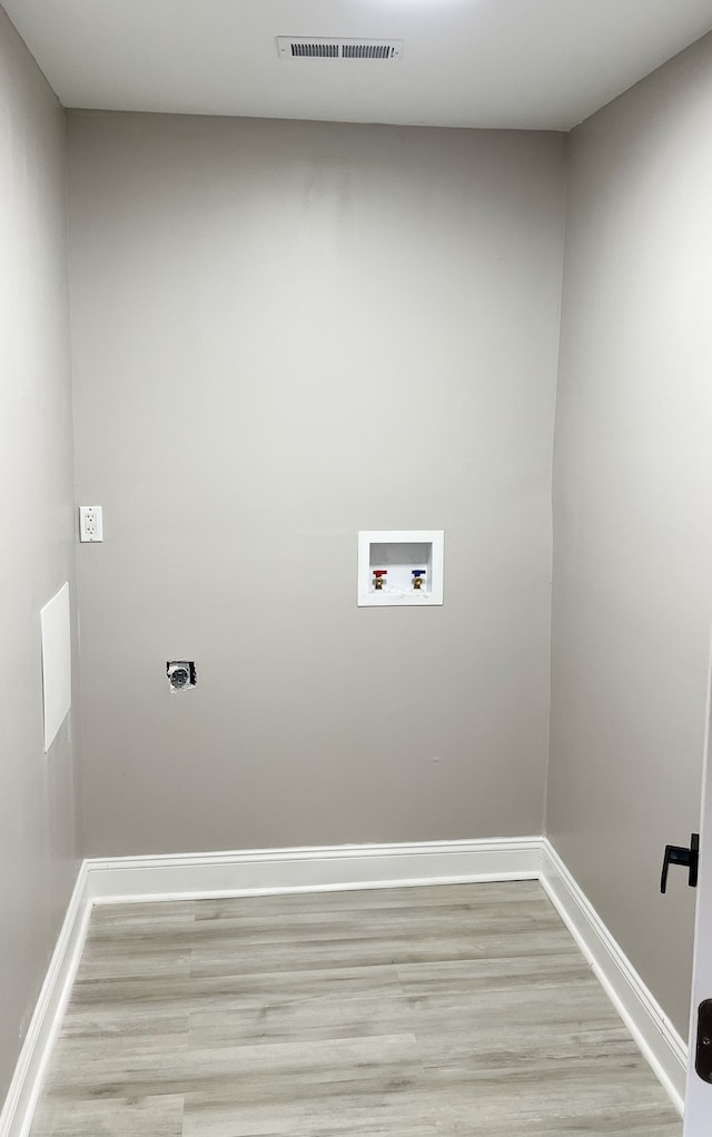2439 Sheridan St, Detroit, MI 48214 - laundry room with laundry area, washer hookup, light wood-style floors, hookup for an electric dryer, and visible vents