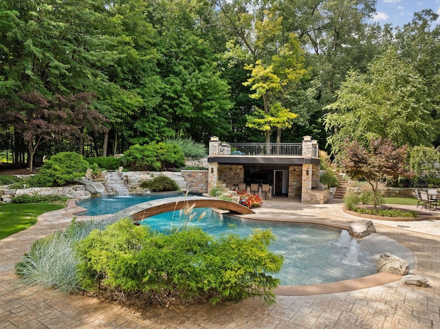 10463 W H Ave, Kalamazoo, MI 49009 - outdoor pool with stairs, a hot tub, and a patio