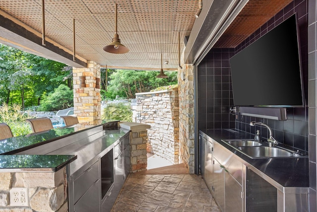 10463 W H Ave, Kalamazoo, MI 49009 - view of patio featuring a sink and exterior kitchen