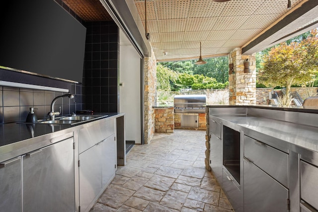 10463 W H Ave, Kalamazoo, MI 49009 - view of patio with grilling area, exterior kitchen, and a sink