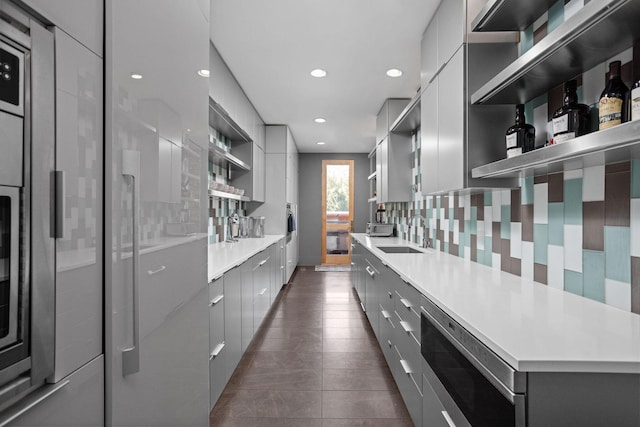 10463 W H Ave, Kalamazoo, MI 49009 - kitchen with modern cabinets, open shelves, gray cabinetry, a sink, and recessed lighting