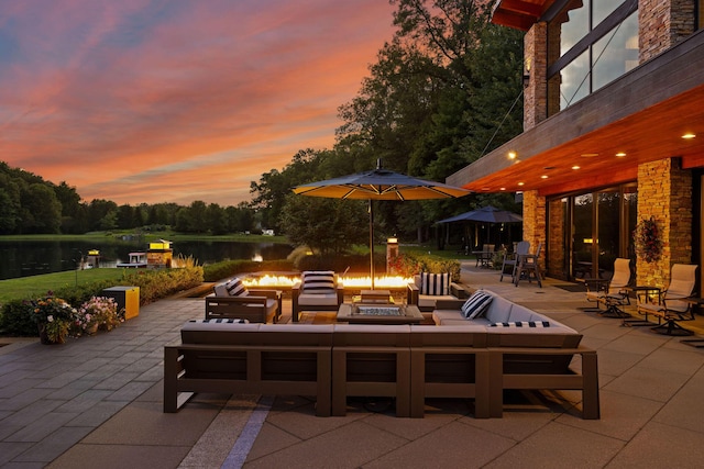 10463 W H Ave, Kalamazoo, MI 49009 - view of patio / terrace featuring a water view and an outdoor living space with a fire pit
