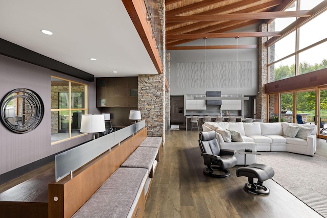 10463 W H Ave, Kalamazoo, MI 49009 - living room featuring beamed ceiling, recessed lighting, a high ceiling, and wood finished floors